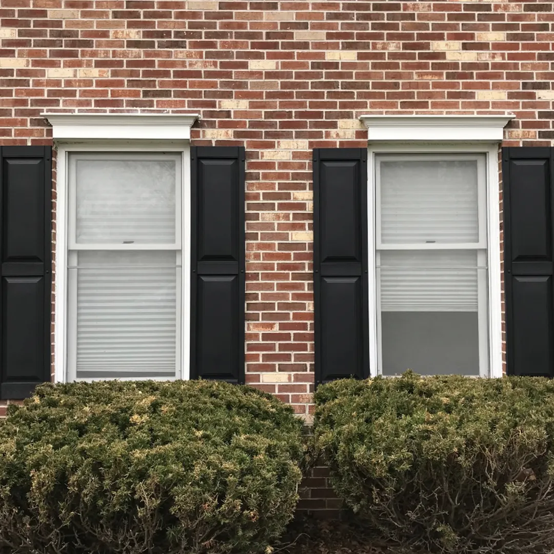 Brick facade before replacing two front windows