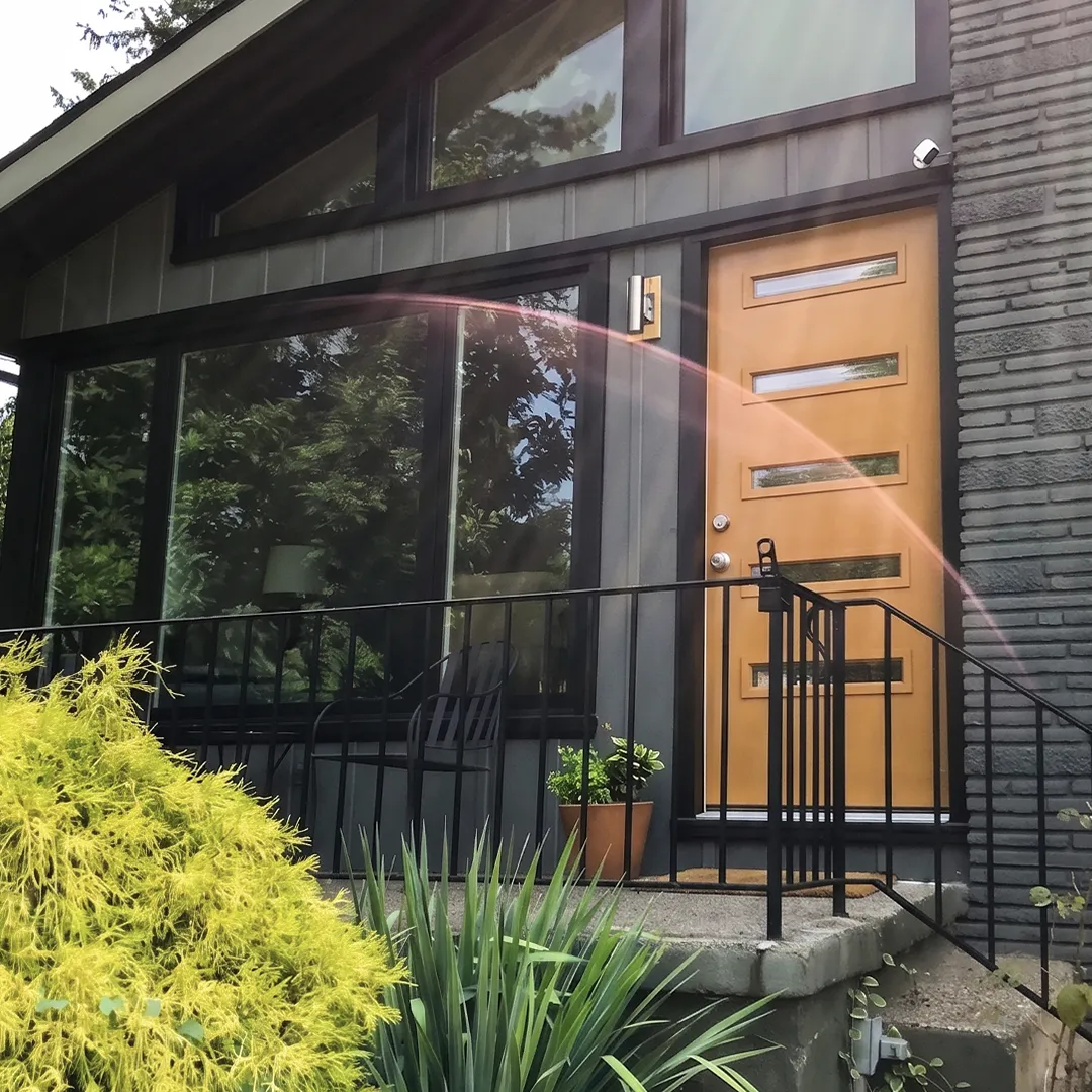 Front entry enclosure after modern black window and door installation
