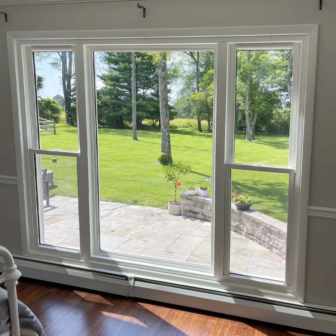 Interior window wall after new white-framed windows were installed