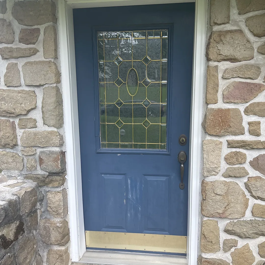 Stone home entry before replacing the front door
