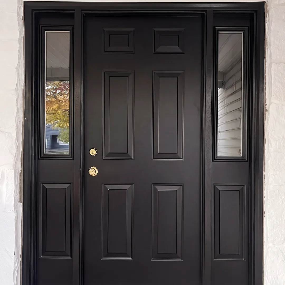 Front entrance after installing a black entry door with sidelights