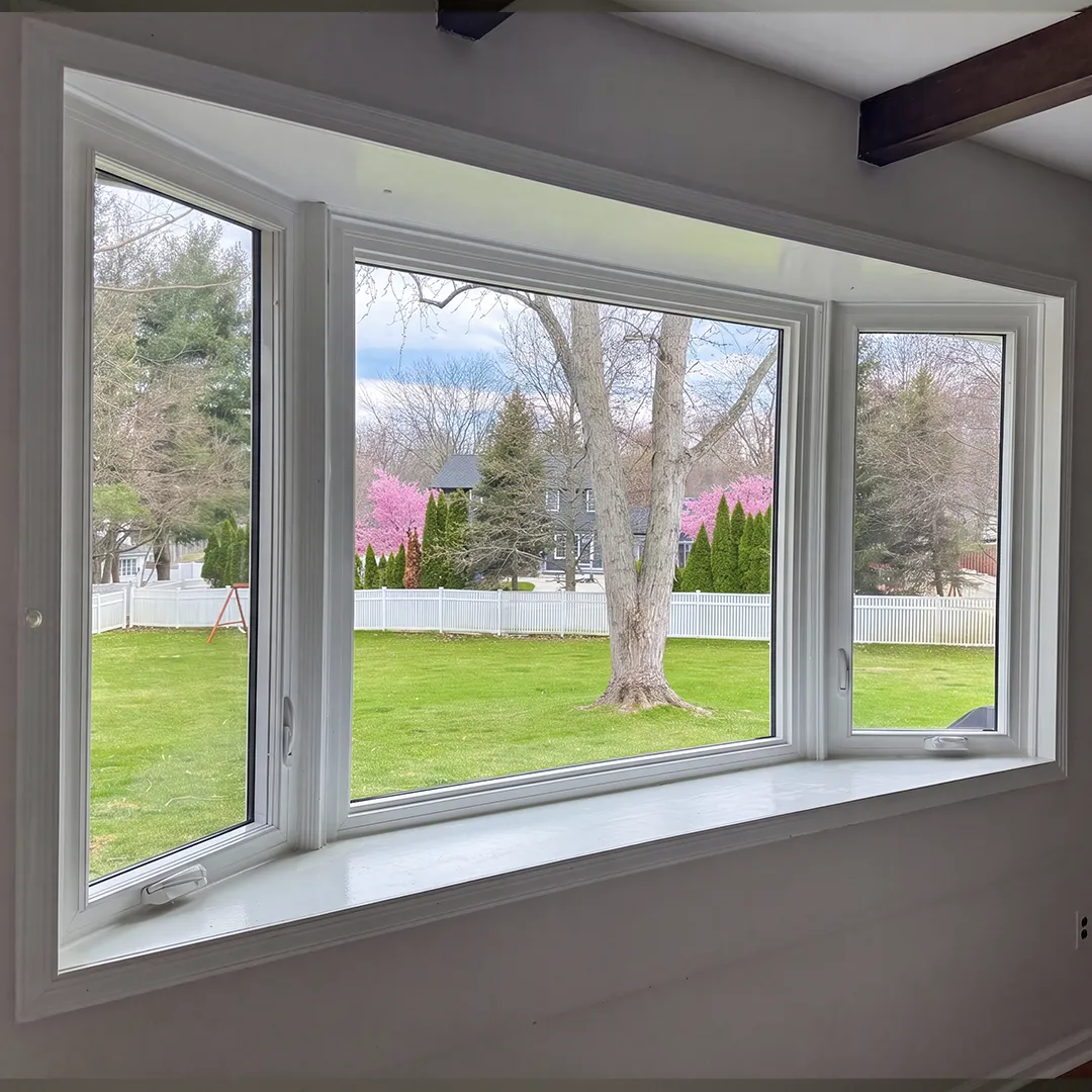 Corner window arrangement after white replacement windows were installed