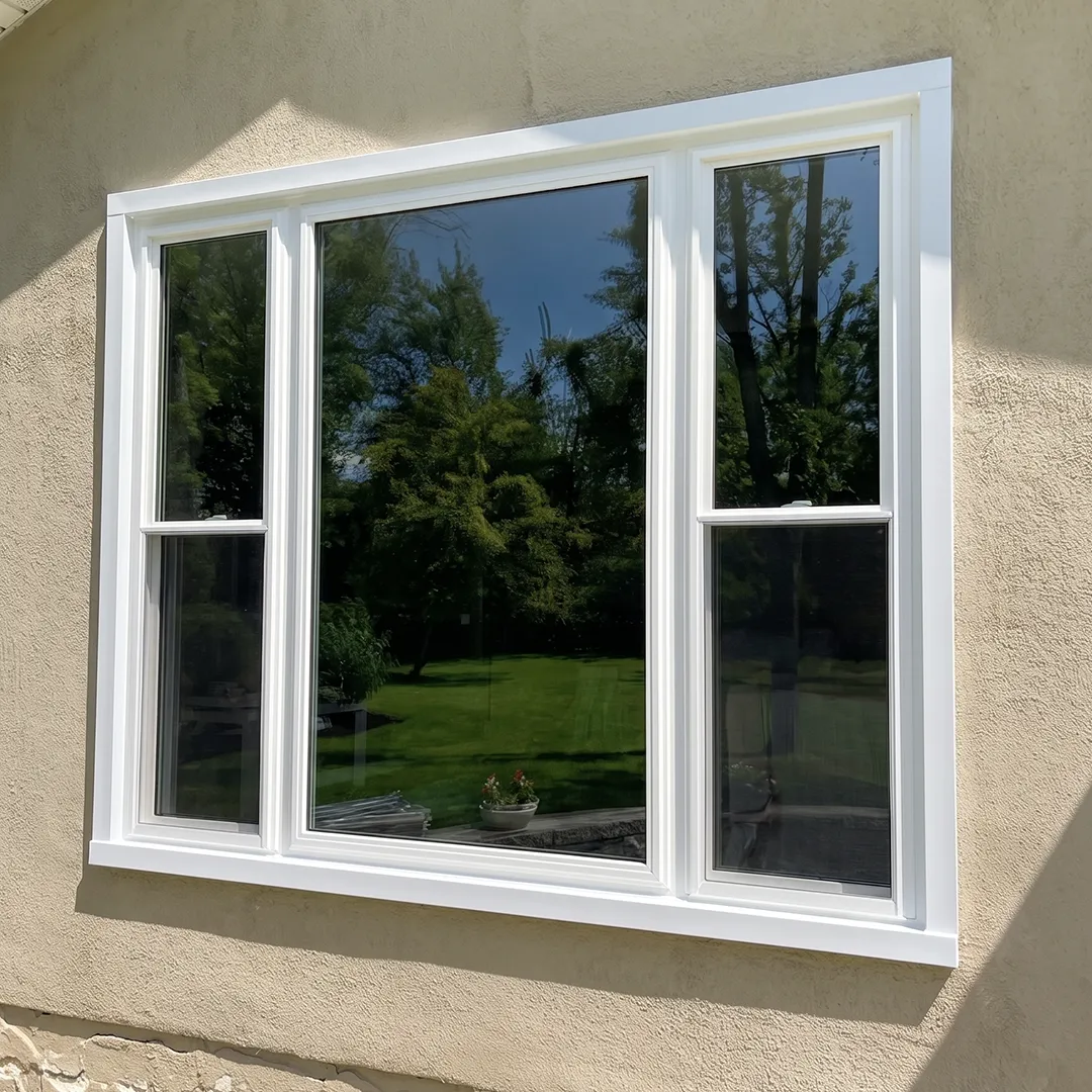 Exterior window after installing a clean white replacement unit