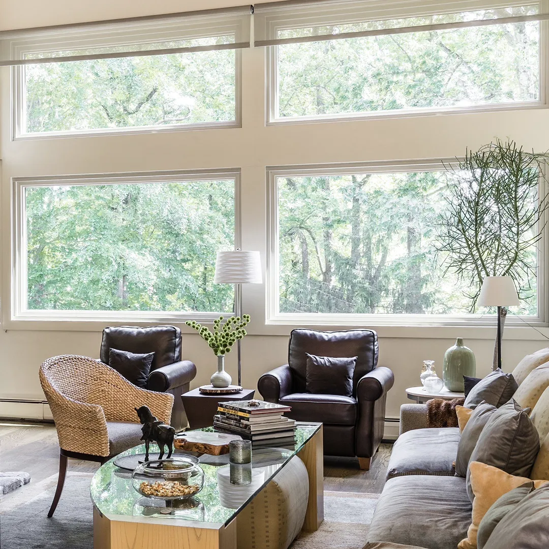 Living room feature windows after installing expansive white-framed units