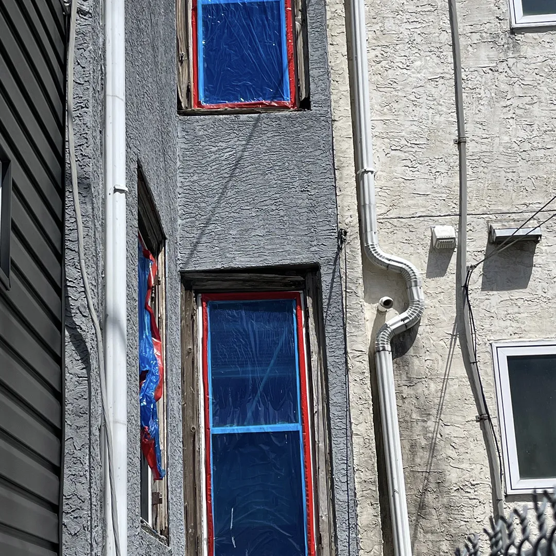 Stucco home window before replacement