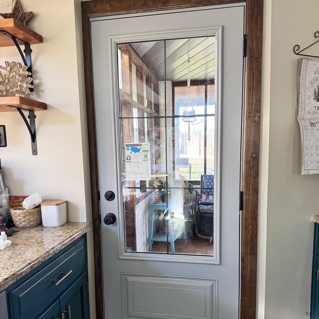 Interior entry after installing a white glass-panel door
