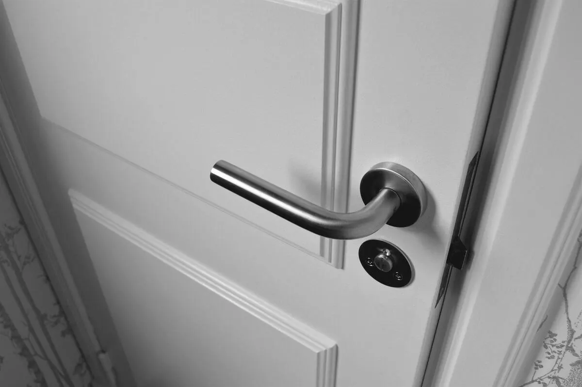 Close-up view of a white-colored door.