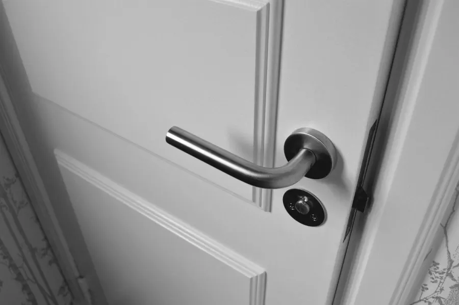 Close-up view of a white-colored door.