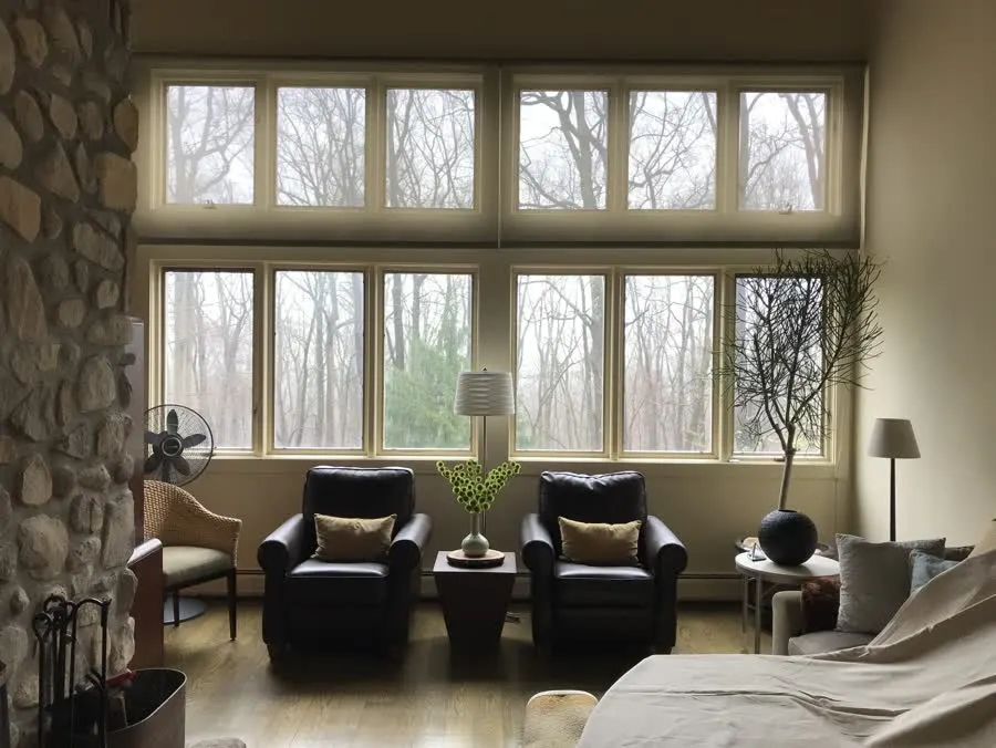 Living room before with old windows letting in little light