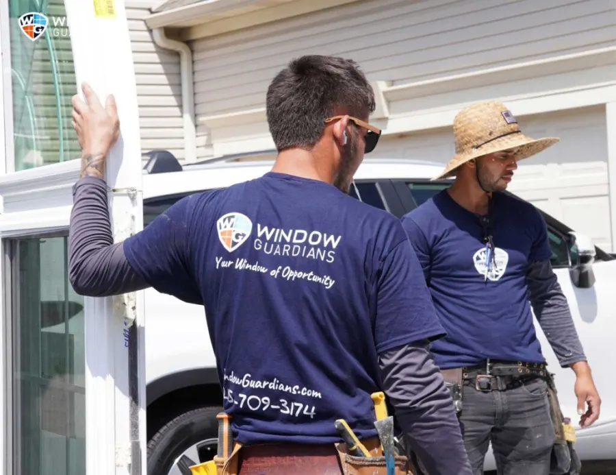 Window Guardians crew working on a window replacement project
