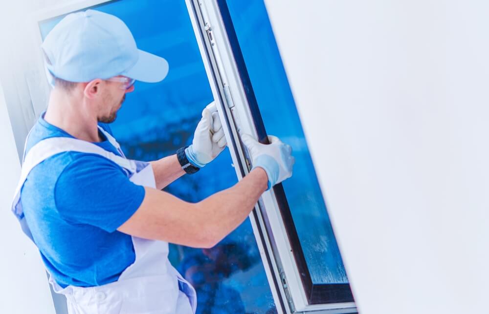 Window specialist installing a new window