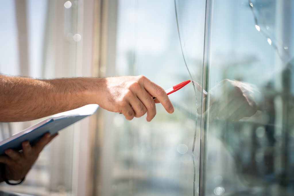 A man checking how to replace glass window