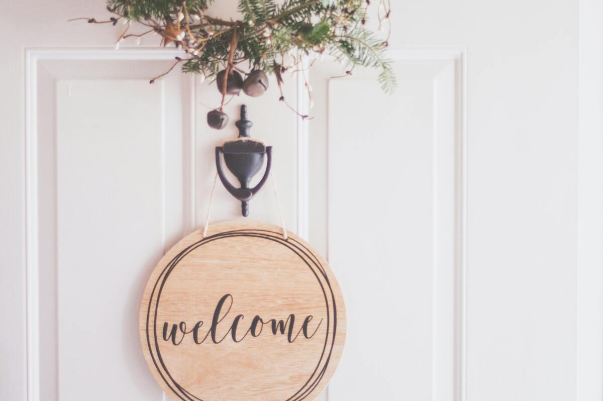 Front door with welcome sign