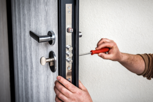 Person performing DIY door replacement