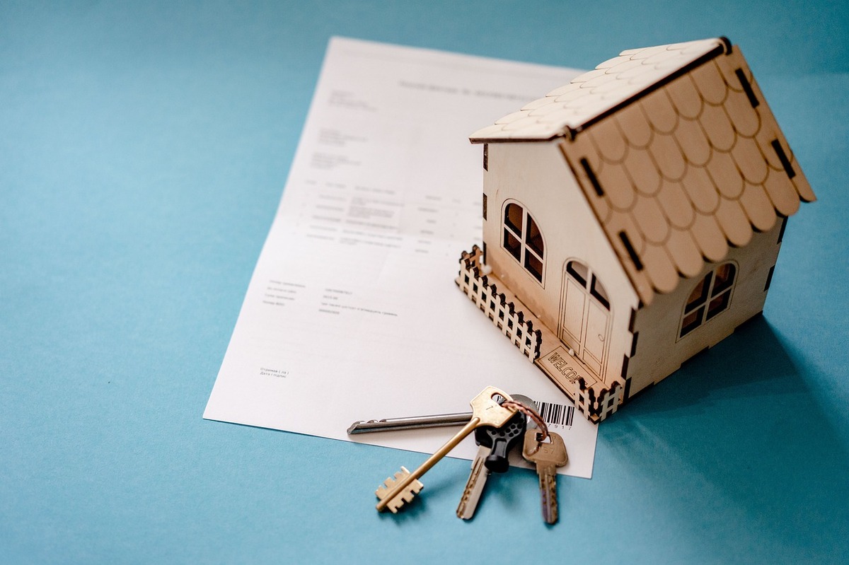 A miniature model house with keys