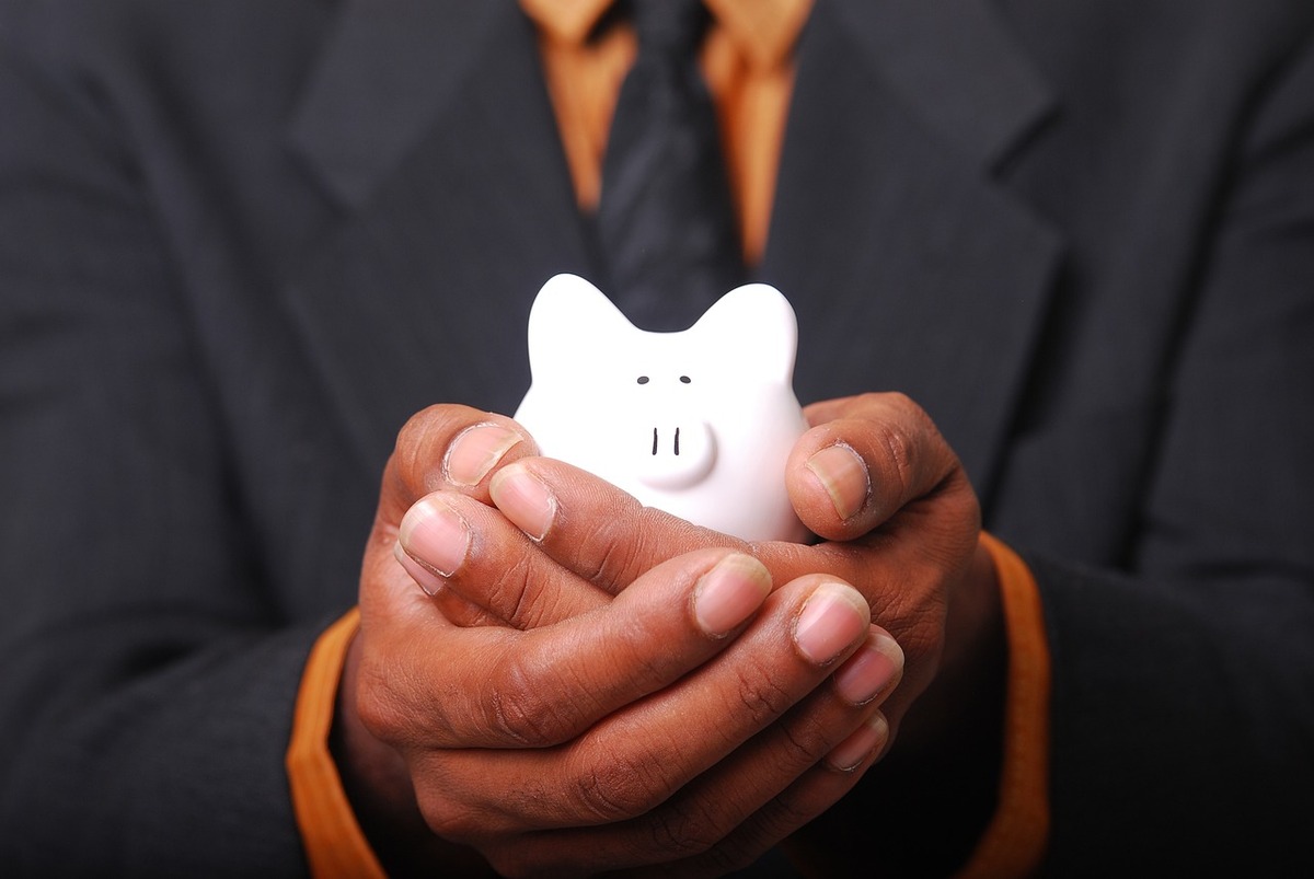 A person holding a piggy bank